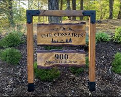 a sign for the coosair's wilderness preserve in front of some trees