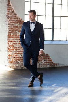 Navy Fitted Tuxedo For Wedding, Fitted Tuxedo With Bow Tie Back For Formal Occasions, Formal Fitted Tuxedo With Bow Tie Back, Fitted Tuxedo With Bow Tie For Wedding, Fitted Wedding Suit With Bow Tie, Classic Navy Suit And Tie Accessories For Wedding, Fitted Dapper Tuxedo With Bow Tie, Dapper Fitted Tuxedo With Bow Tie, Fitted Bow Tie With Bow Tie Back For Wedding