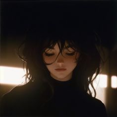 a woman with dark hair and bangs wearing a black top is staring at the camera