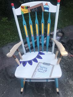 a wooden chair with toothbrushes painted on it