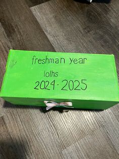 a green box with the words freshman year on it