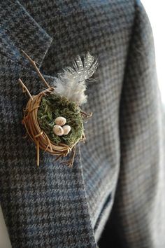 a bird's nest in the lapel of a jacket