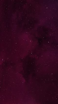 the night sky is filled with stars and purple hues, as well as dark clouds