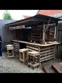 an outdoor bar made out of wooden pallets