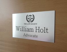 the sign on the door says william holt advocate