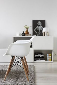 a white chair sitting on top of a wooden floor