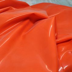 This high quality, fashion-grade latex sheeting is perfect for bringing your latex dreams to life!   The material is imported from England, and is .40mm gauge.  It obtains a glossy shine when treated with latex care products.  The material is lightly powdered for shipping. 39 inches wide and sold in continuous yards. (1 yard = 36 inches or 91 cm). Orange Sheets, Quality Fashion, Care Products, Photo Inspiration, Etsy Accessories, Craft Supplies, Purses And Bags, Music Clothes, Orange