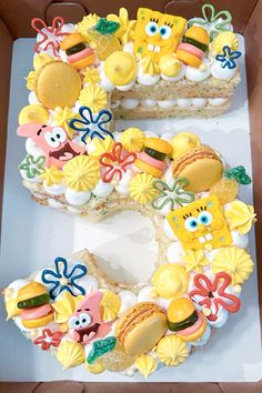 the cake is decorated with different types of food