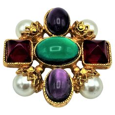 About Chanel brooch or to wear as a pendant by Gripoix Paris. Beautiful cast glass colors and handmade glass beads. Measurement: H 4,8 cm x W 4,5 cm, D 1,5 cm. Pearl size 1 cm in diameter, Features - Autentique Chanel broch, signed on the back 07 A = 2007 autonm - red pyramid shaped Gripoix 1 cm, the oval green stone 1,8 x 1,3 cm - Very good condition - Chanel is forever Luxury Gold Vintage Pins, Brooch Jewelry 1stdibs, Chanel Jewellery, Vintage Chanel Jewelry, Red Pyramid, Byzantine Jewelry, Designer Costume Jewelry, Chanel Brooch, Cast Glass