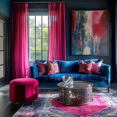 a living room with blue couches, pink curtains and a large painting on the wall