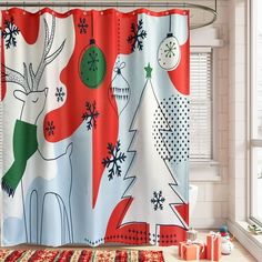 the shower curtain is decorated with christmas ornaments and deers on red, white, and green