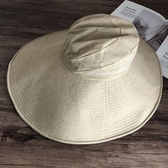 Introducing our Elegant Japanese-Inspired Extra Large Brim UV Protection Sun Hat, the perfect blend of style and functionality. Designed to provide maximum sun protection while maintaining a chic and sophisticated look, this hat is an essential accessory for any outdoor occasion. High-Quality Material: Made from premium linen for durability and breathability. Extra Large Brim: Front brim measures approximately 14.5 cm, back brim approximately 18.5 cm. 360-Degree Sun Protection: Provides full cov Lightweight Curved Brim Beach Hat, Lightweight Curved Brim Hat For Beach, Lightweight Beach Hat With Curved Brim, Lightweight Wide Brim Hat For Beach, Lightweight Wide Brim Hat For The Beach, Lightweight Beige Travel Hat, Outdoor Straw Hat With Upf 50+, Hats With Uv Protection For Beach Season, Lightweight Sun Hat With Flat Brim