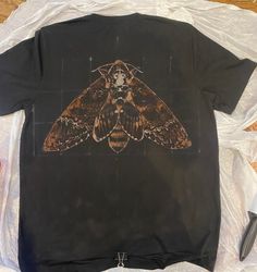 I hand paint these shirts  with custom nature-themed bleach designs. Commissions are open - just put the info in the personalization textbox. Pick a species of animal, plant ,fish, bug, etc. for the shirt design. Main designs can be painted on the front of the shirt or on the back with a small design on the front. The shirts  are a cotton/polyester blend and come in unisex sizes S through 3X. Please message me with any questions! Bleached Ribcage Shirt, Bleached Painted Shirt, Bleached Top Designs, Bug Themed Clothes, Goth Bleach Shirt, Bleach Jumper Design, Bleached T Shirt Designs, Bleaching T Shirt, Bleach Clothes Ideas