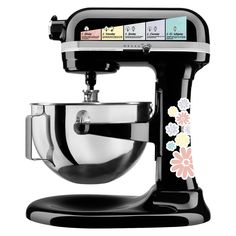 a black stand mixer with flowers on it