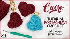 the crochet heart keychain is next to two hearts