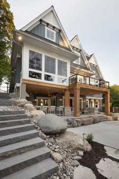 a large house with stone steps leading up to it