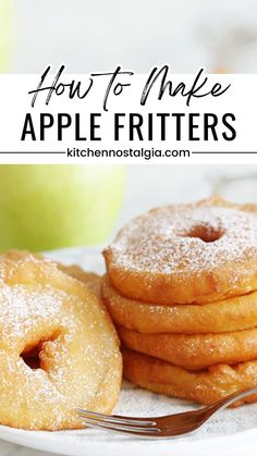 apple fritters are stacked on a plate with a fork and an apple in the background