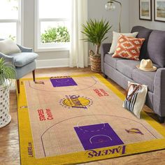 a living room with a couch, chair and basketball court rug