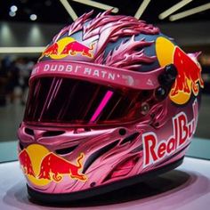 helmet on display at indoor event with red bull sign in the backgroung