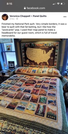 a bed with a quilt on top of it and a map above the bedspread