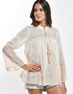 White bohemian embroidered top with lurex woven in for extra dreamy styling. Paired here with our Feeling Peachy ultra wide leg high waist pants. Beige Long Sleeve Embroidered Summer Top, Spring Festival Beige Peasant Top, Spring Bohemian Relaxed Fit Tops, Bohemian Relaxed Fit Tops For Spring, Spring Bohemian Top With Embroidered Hem, Summer Feminine Embroidered Blouse, Feminine Embroidered Summer Blouse, Summer Embroidered Feminine Blouse, Casual Embroidered Top With Boho Collar For Spring