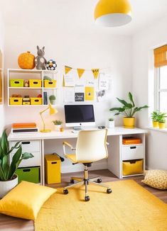 a white desk topped with a computer sitting on top of a yellow rug