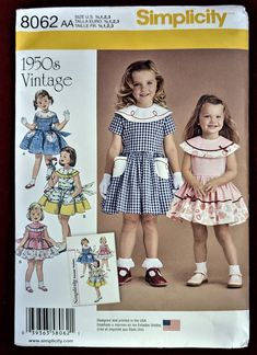 "Simplicity Re-Issued \"1950s Vintage\"  Toddlers' And Child's Charming Full Skirted Dress  Multi-Size (1/2, 1, 2, 3)  Pattern 8062   New Factory Folded This re-issued \"1950s Vintage\" Simplicity pattern features a full skirted dress with embellished circle collar, with or without pockets, short sleeves or sleeveless and completing both looks is a button down back with tie-back sash. The charming look of the Fifties, is timeless and sure to delight both the child and the adult. Unlike the original pattern this pattern is multi-size making a custom fit a breeze. Pattern is new and factory folded." 1950s Dress Patterns, 1950's Dress, Child Dress, Style Types, Simplicity Dress, Girl Dress Pattern, Kids Dress Patterns, Vintage Toddler, Sewing Patterns Girls