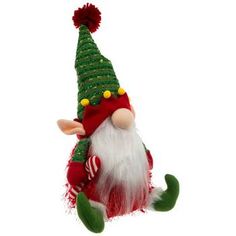 a green and red christmas gnome ornament hanging from a string on a white background