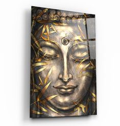 a painting on the wall of a buddha face with eyes closed and gold lines around it