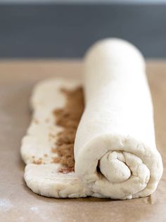 a rolled up pastry sitting on top of a counter