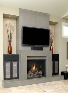 a fireplace with a flat screen tv above it