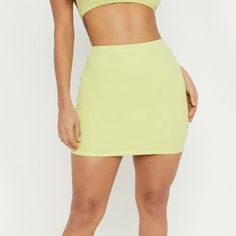 Never Worn !!! Lime Green, Jersey Material . Spring Yellow Solid Color Skirt, Yellow Solid Color Skirt For Spring, Yellow Solid Color Skirt For Summer, Fitted Yellow Bottoms Solid Color, Fitted Yellow Solid Color Bottoms, Casual Solid Yellow Skirt, Fitted Yellow Bottoms, Yellow High-waist Skirt For Summer, Yellow Stretch Skort For Spring