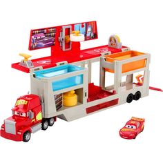 a toy firetruck with cars and a sink