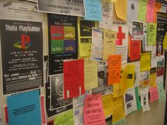 a bulletin board covered in lots of different colored papers and post - its on it