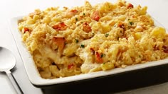 a casserole dish with chicken, cheese and vegetables