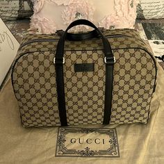 Gucci Original Gg Canvas Carry On Duffle Bag. This Is The Perfect Designer Handbag To Travel With And Has Plenty Of Storage Space. This Design Is Very Classy And Traditional. Goes Well With Most Looks And Is Easy To Carry Or Wear Over The Shoulder. Includes Authenticity Cards And Gucci Dust-Bag. Model: 449167 Beige Canvas With Brown Leather Trim Gucci Leather Logo On Front Face Zipper Closure One Interior Slip Pocket One Interior Zip Pocket Removable And Adjustable Shoulder Strap Double-Handle D Gucci Luggage Travel, Carry On Duffle Bag, Front Face, Lv Handbags, Gucci Leather, Designer Handbag, Leather Logo, Gucci Bags, Lv Bag