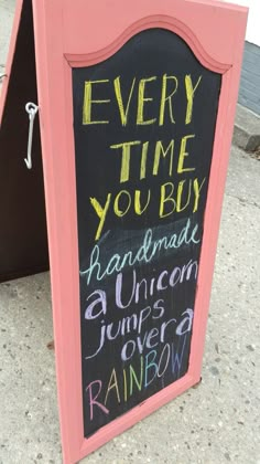 a chalkboard sign that says every time you buy handmade unicorn jumps over a rainbow