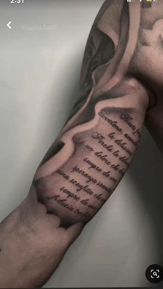 a man's arm with some writing on it