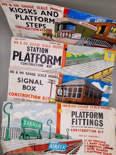 four different types of train station signs on display in a museum or office building with information about them