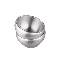 two stainless steel bowls sitting on top of each other