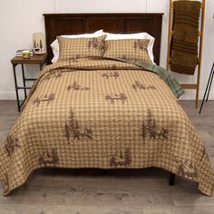 a bed with a brown and white checkered comforter