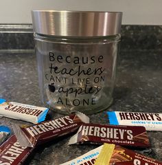 hershey's chocolates are sitting on the counter next to a glass jar that says because teachers can't live on apple alone