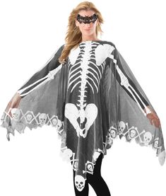 a woman wearing a skeleton costume with skulls and bones on her chest, standing in front of a white background