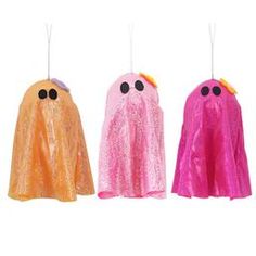 three different colored plastic ghost decorations hanging from strings