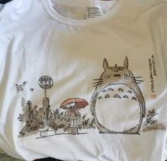 a t - shirt with a totoro drawn on it