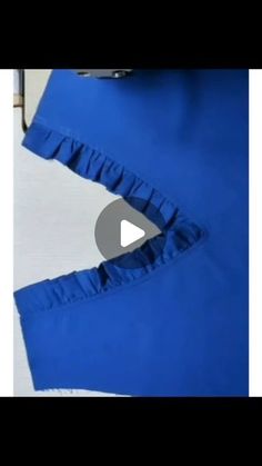 the bottom part of a blue dress with ruffles on it, and an image of