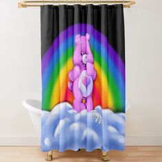 a shower curtain with a pink teddy bear in the clouds and a rainbow behind it