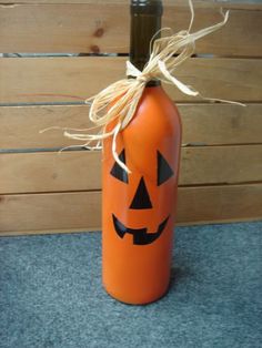 an orange bottle with a jack o lantern on it