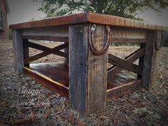 an old wooden table with a rope on the end and some wood chips around it