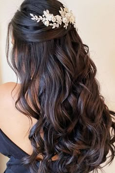 the back of a woman's head wearing a bridal hair piece